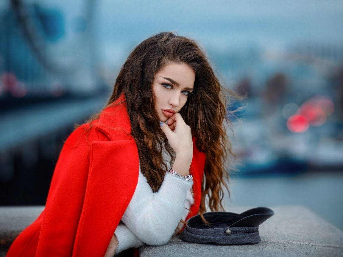 Attitude Girl Wearing A Large Red Coat Background