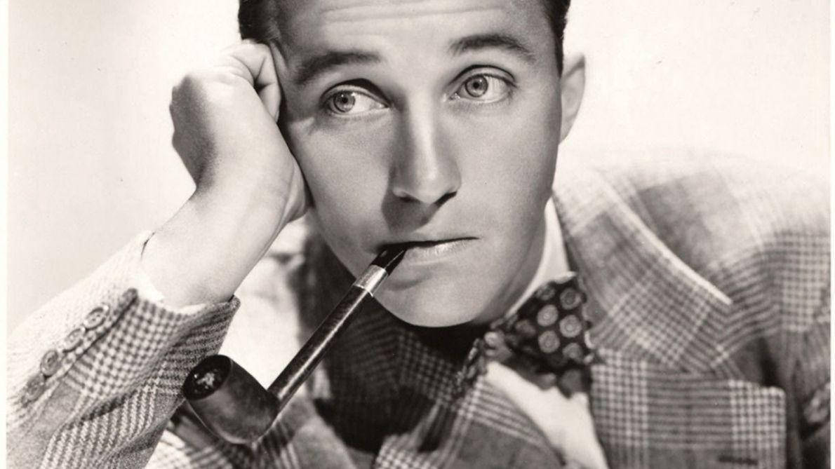 Attractive Bing Crosby Using Tobacco Pipe Background