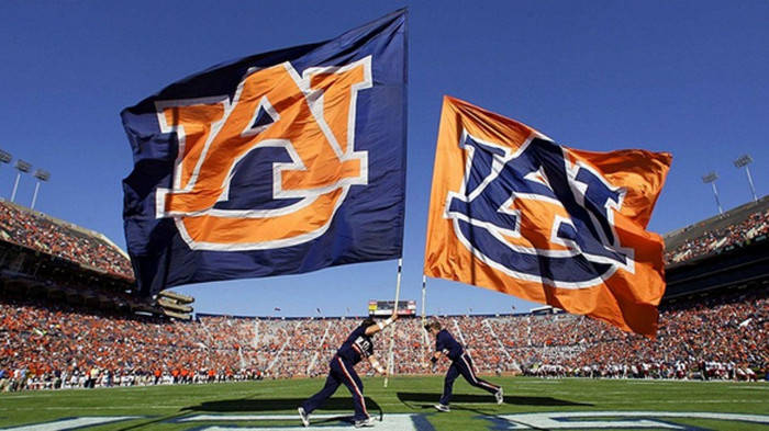 Auburn Football Two Men Charging With Flags Background