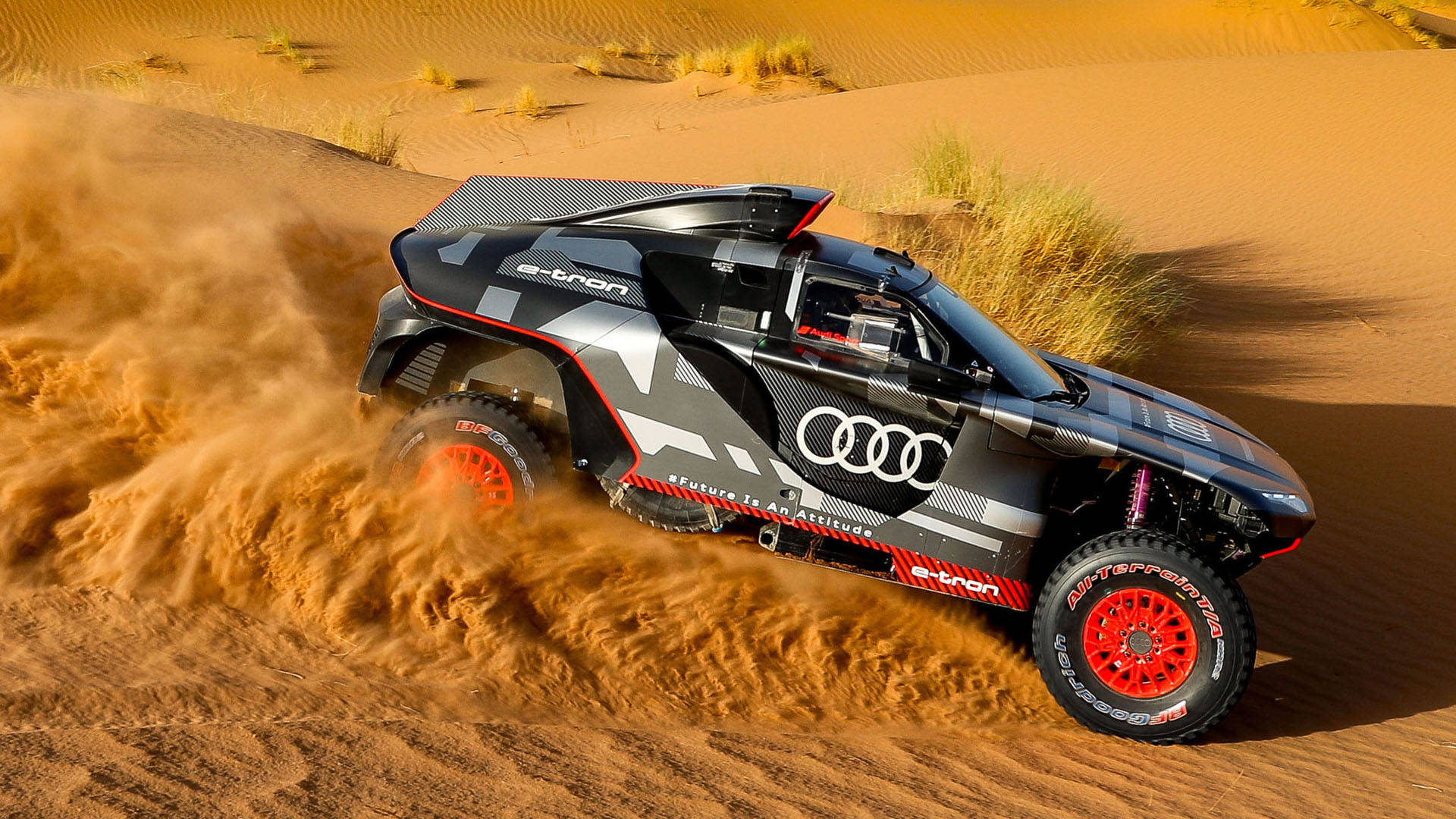 Audi Rs Speeding Through The Dakar Rally Background