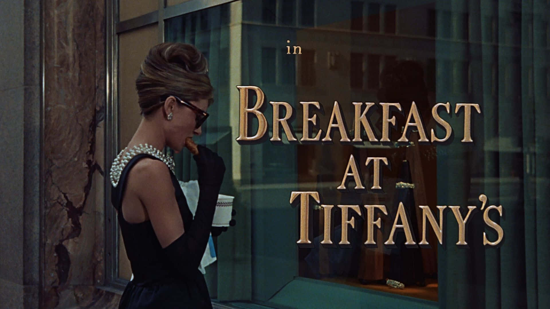 Audrey Hepburn Outside Of Tiffany's Jewelry Looking Beautiful In Her Signature Style