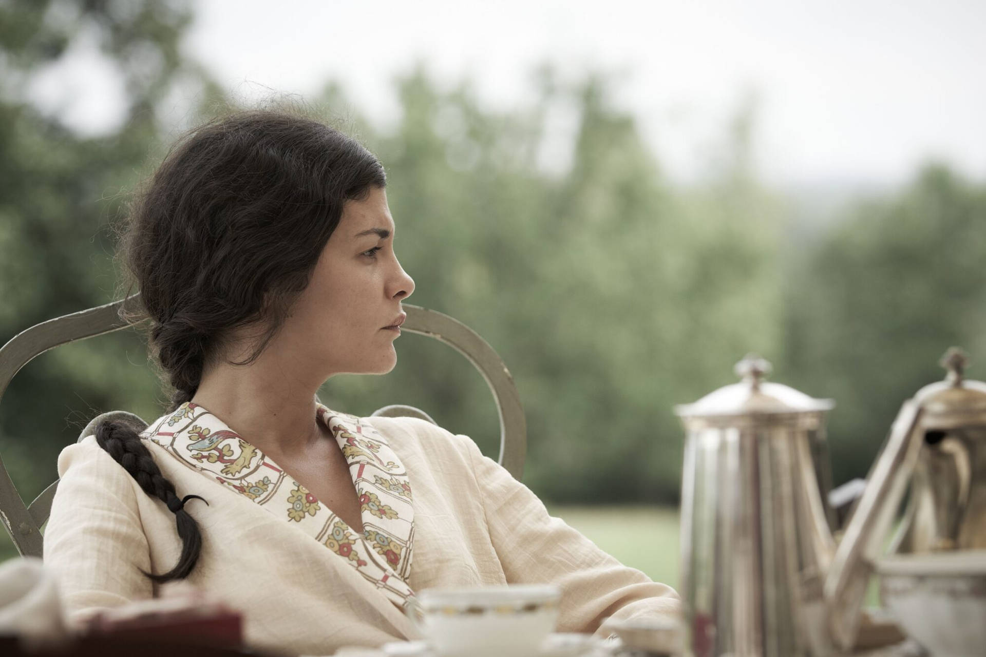 Audrey Tautou Enjoying A Coffee Break Background