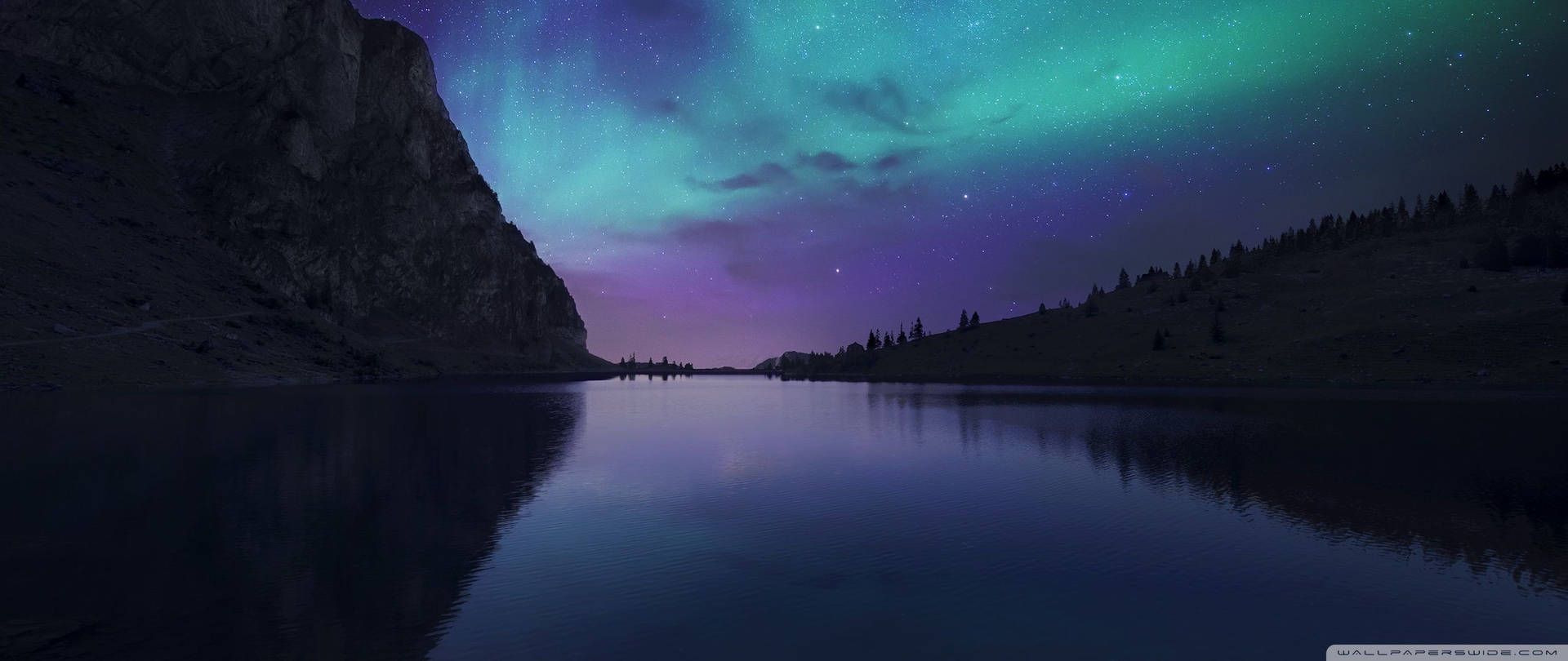 Aurora Borealis Lights Up The Dark Winter Sky Background