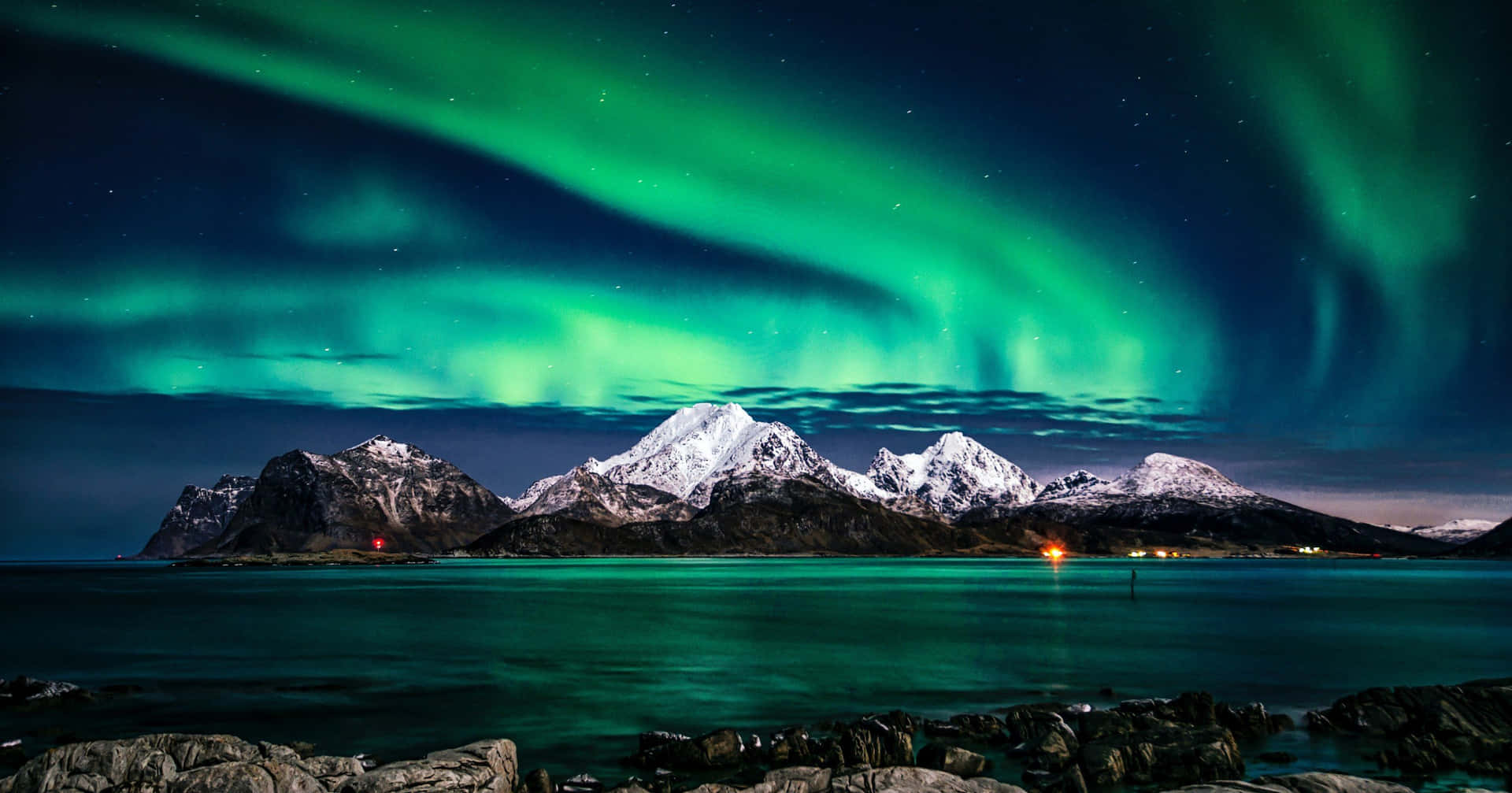 Aurora Borealis Over Snowy Mountains Background