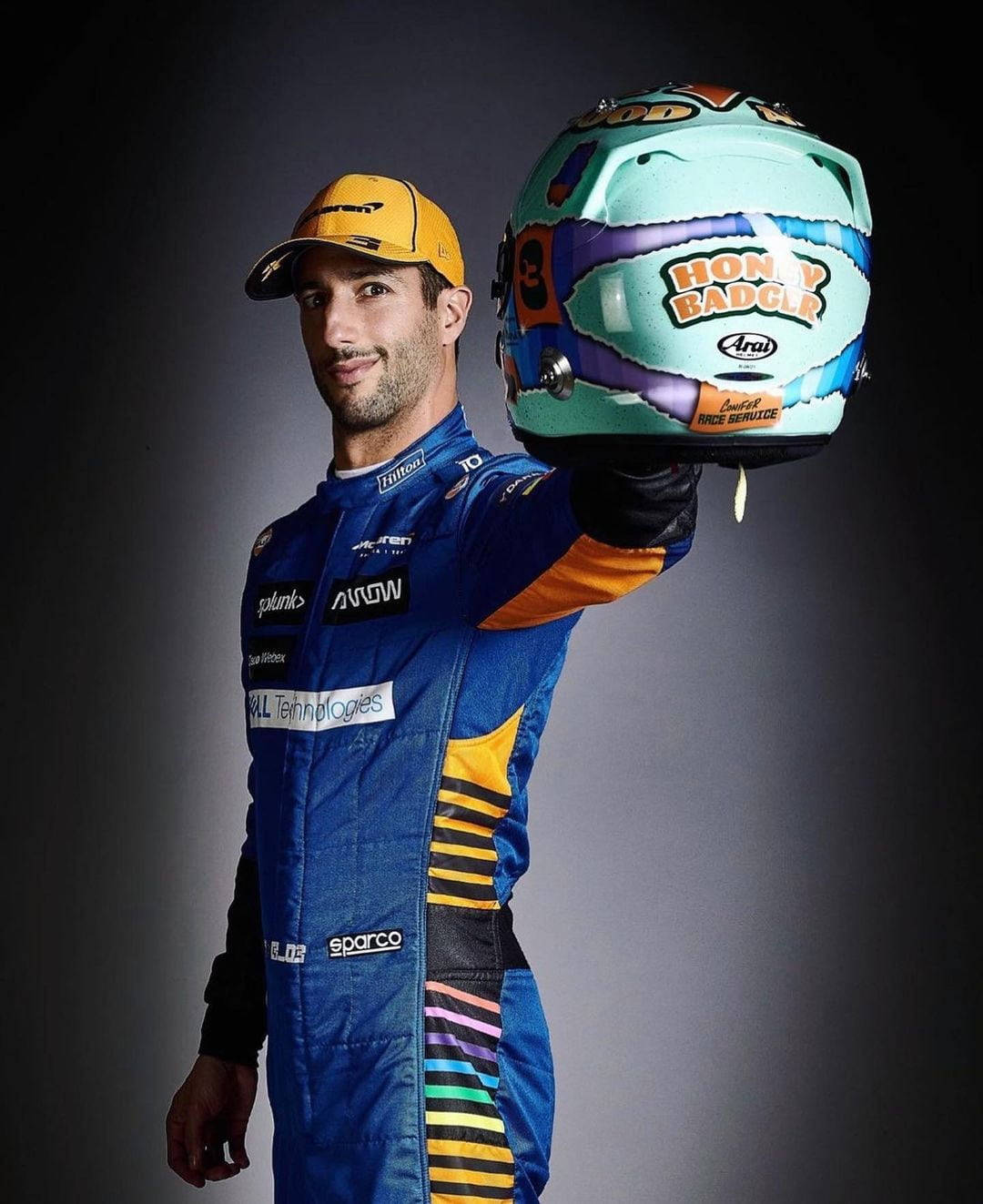 Aussie F1 Star Daniel Ricciardo With His Racing Helmet Background