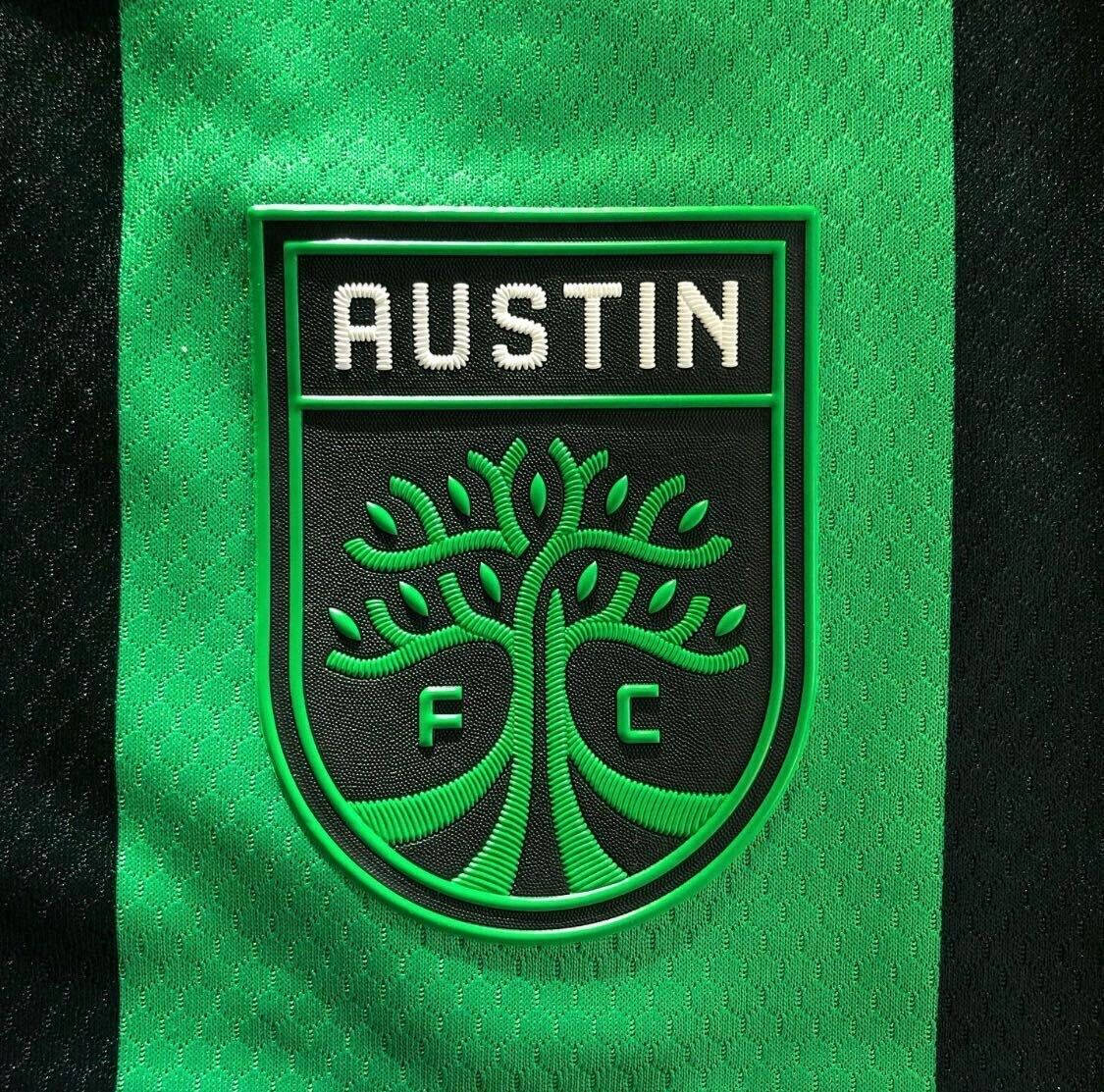 Austin Fc Soccer Club Official Logo On Uniform Background