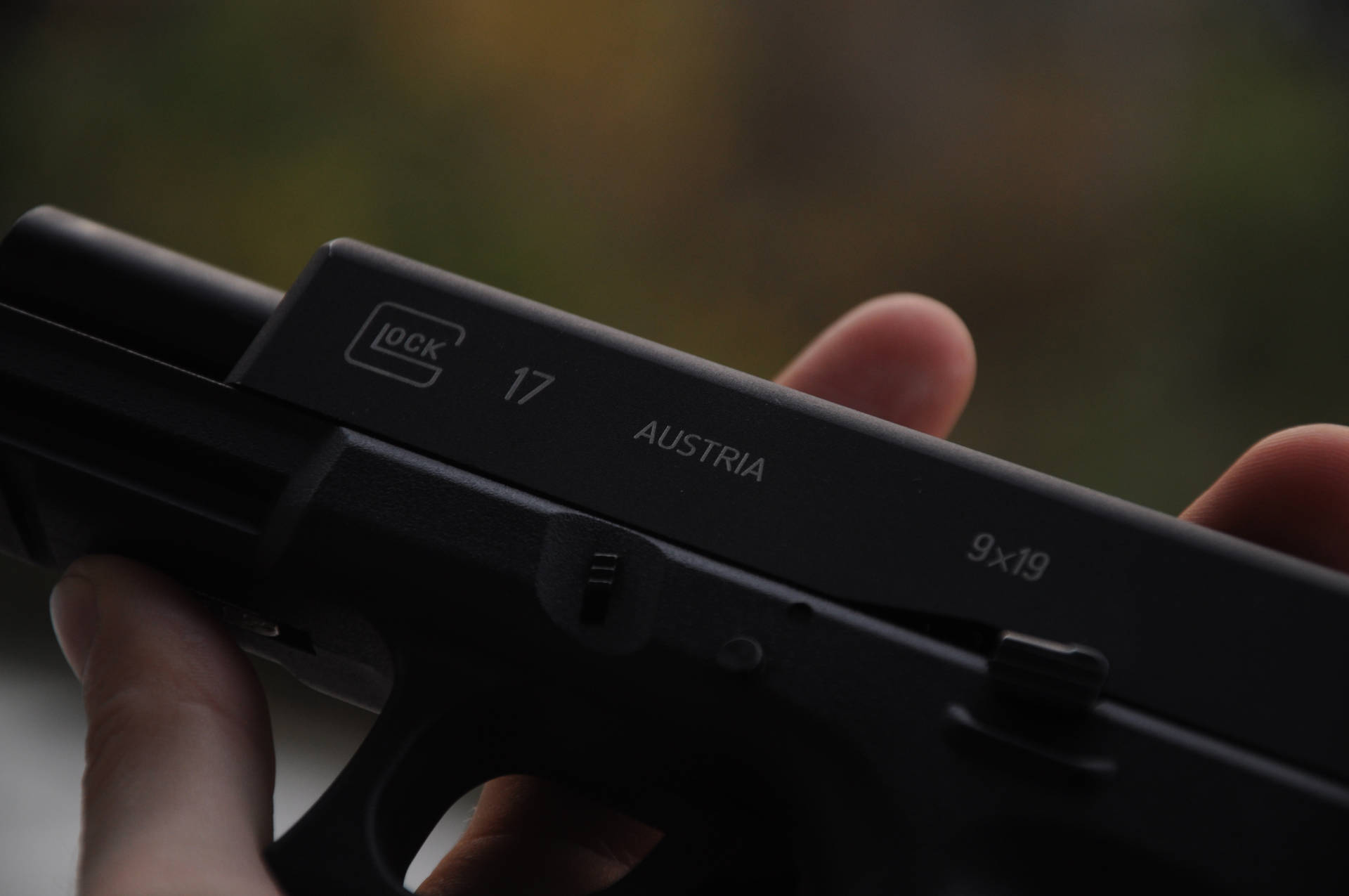Austrian Glock-17 In Hand Background