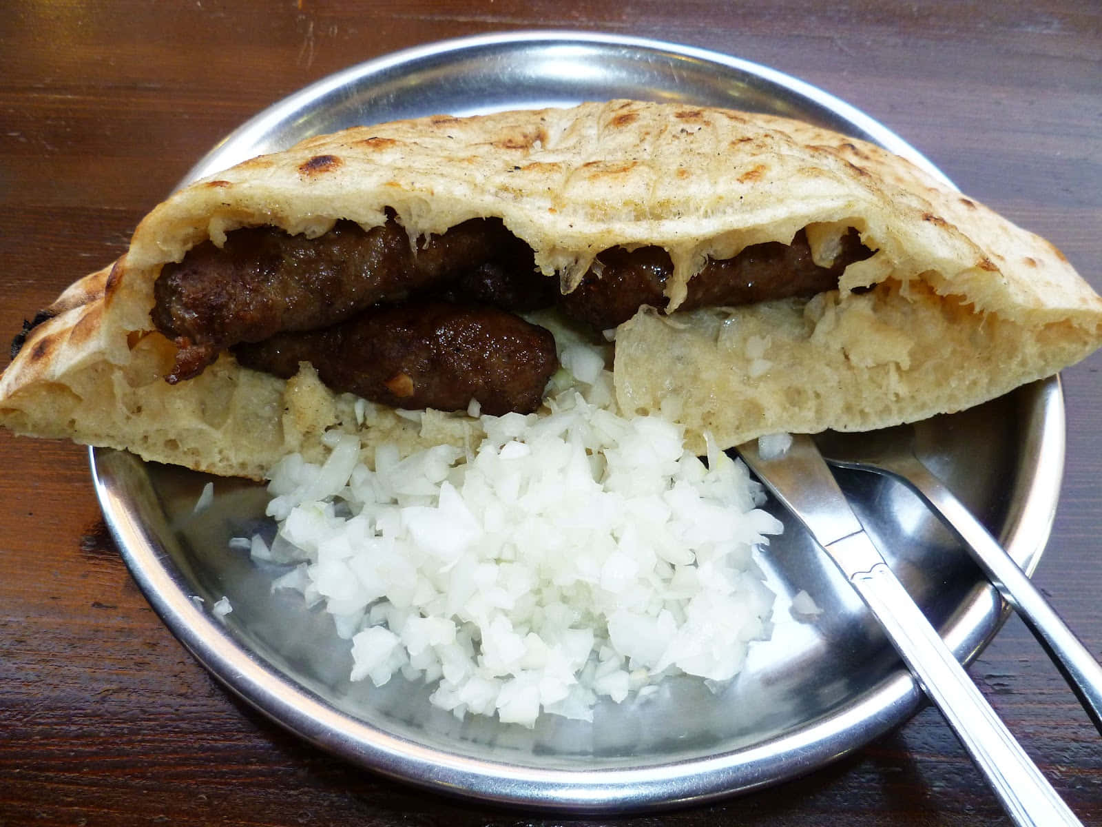 Authentic Balkan Cevapi Served In Fluffy Pita Bread Background