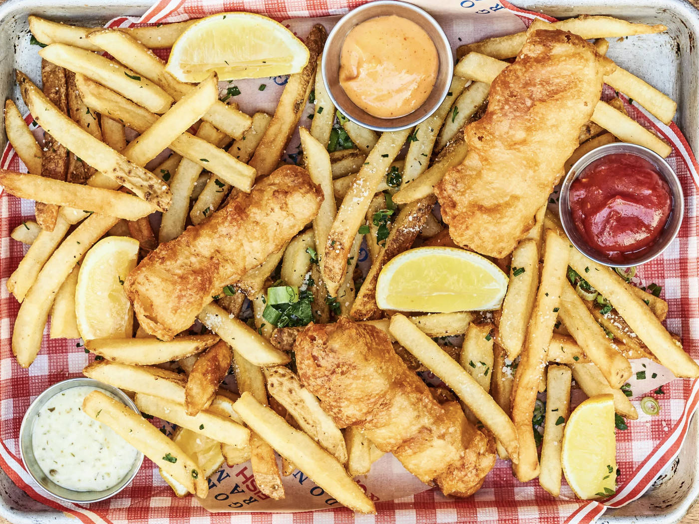 Authentic British Cuisine: A Tray Full Of Delicious Fish And Chips