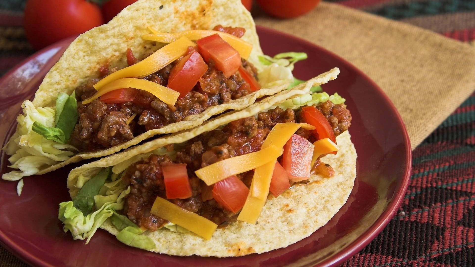 Authentic Flavors - Gourmet Tacos On A Plate Background
