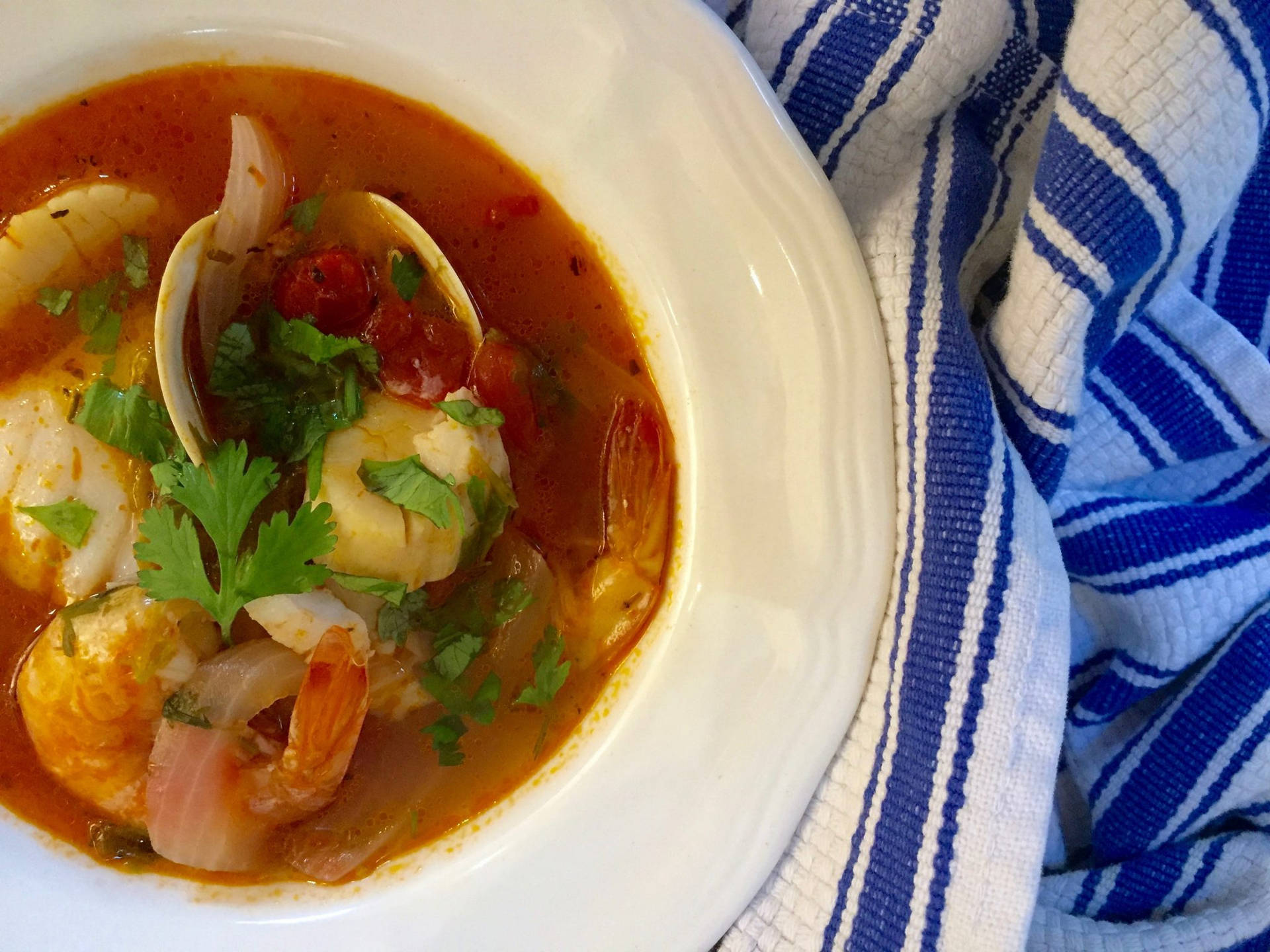 Authentic French Bouillabaisse On Striped Tablecloth Background