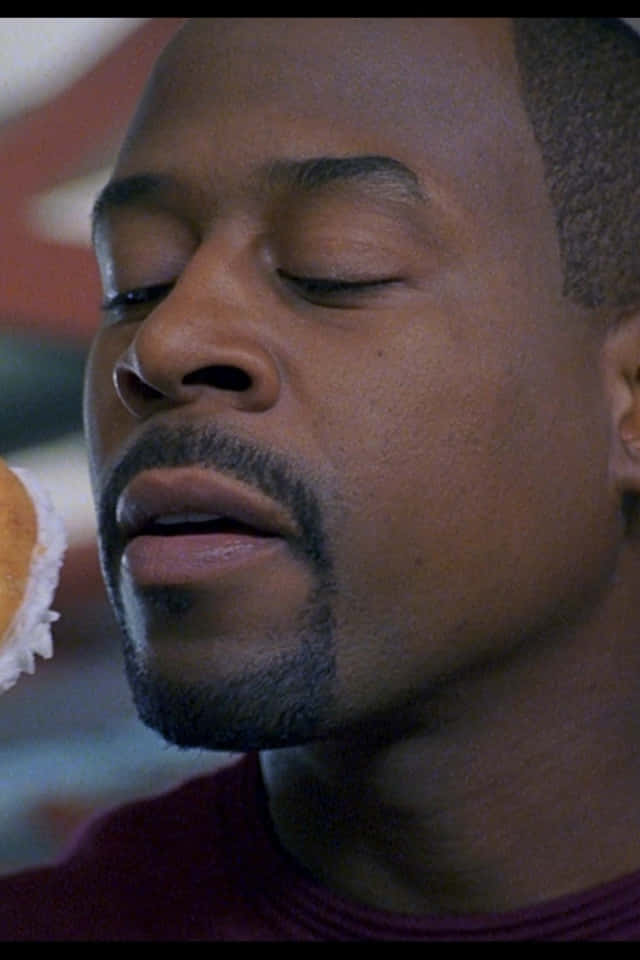 Authentic Image Of Martin Lawrence In An Energetic Performance Background