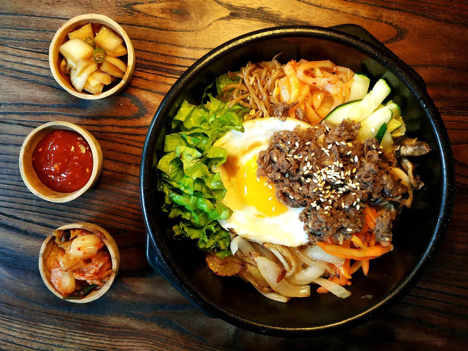 Authentic Korean Bibimbap Dish Served With Side Dishes Background