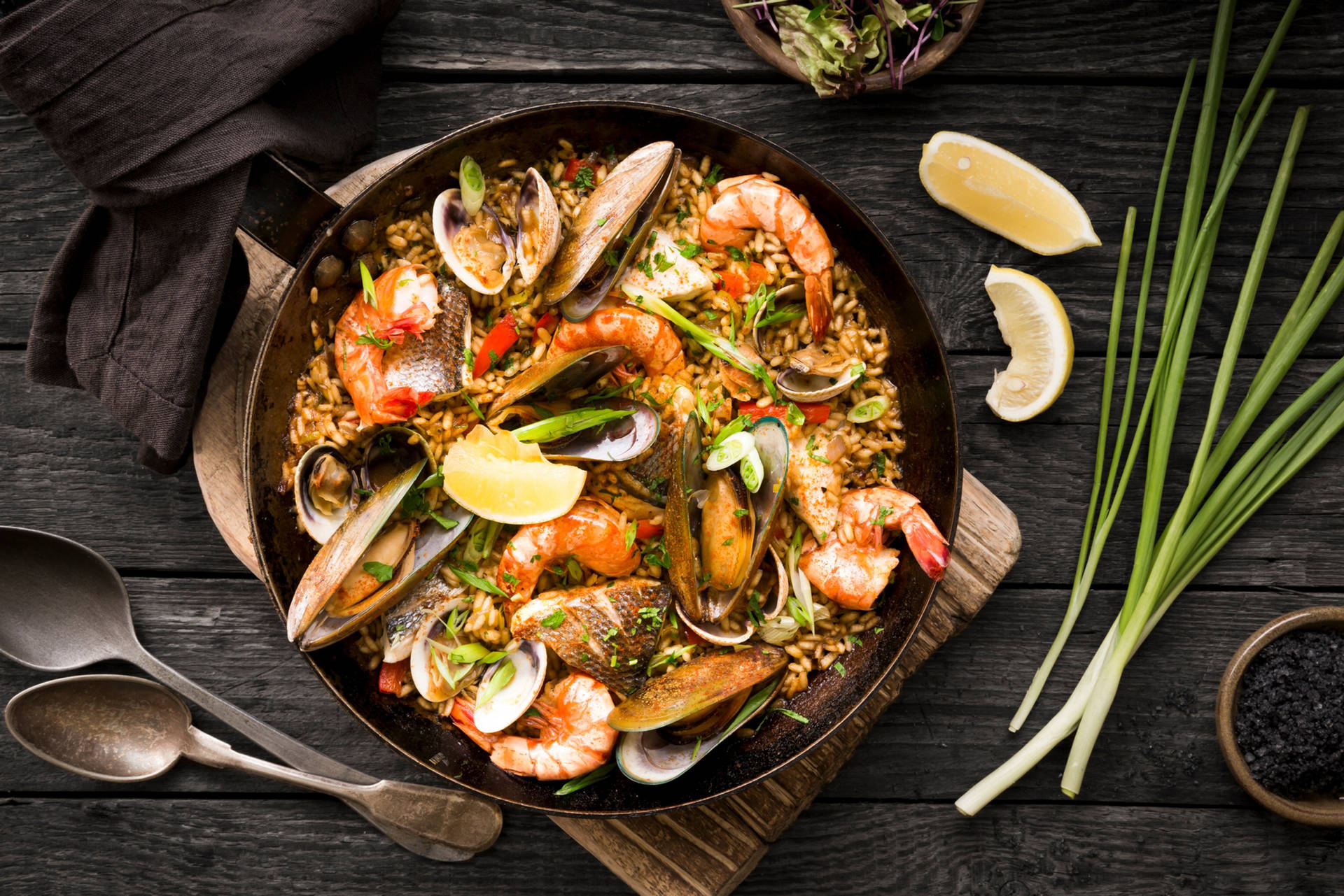 Authentic Spanish Seafood Paella In A Traditional Paella Pan Background