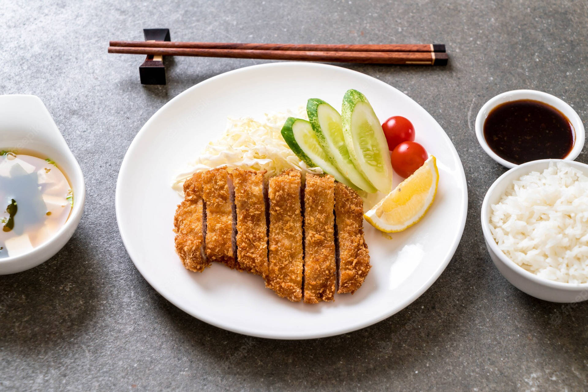 Authentic Tonkatsu Pork Cutlet With Fresh Cucumber Slices Background