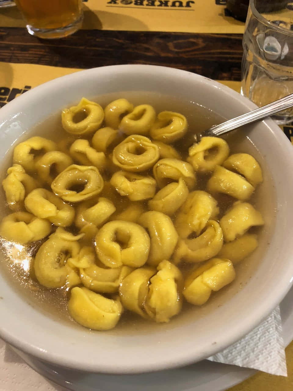 Authentic Tortellini In Brodo Served In A Restaurant Background