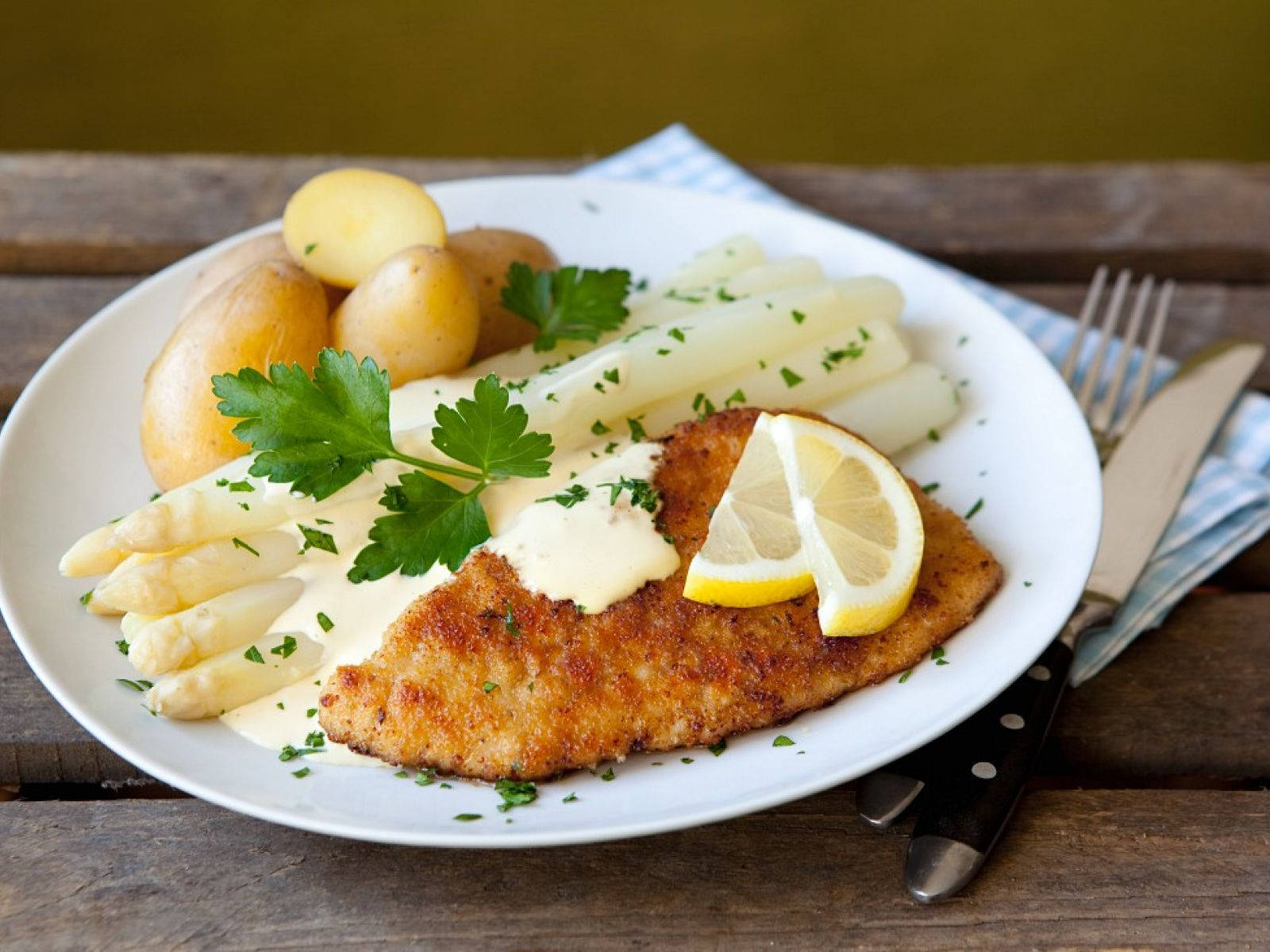 Authentic Wiener Schnitzel Served On A White Dish Background