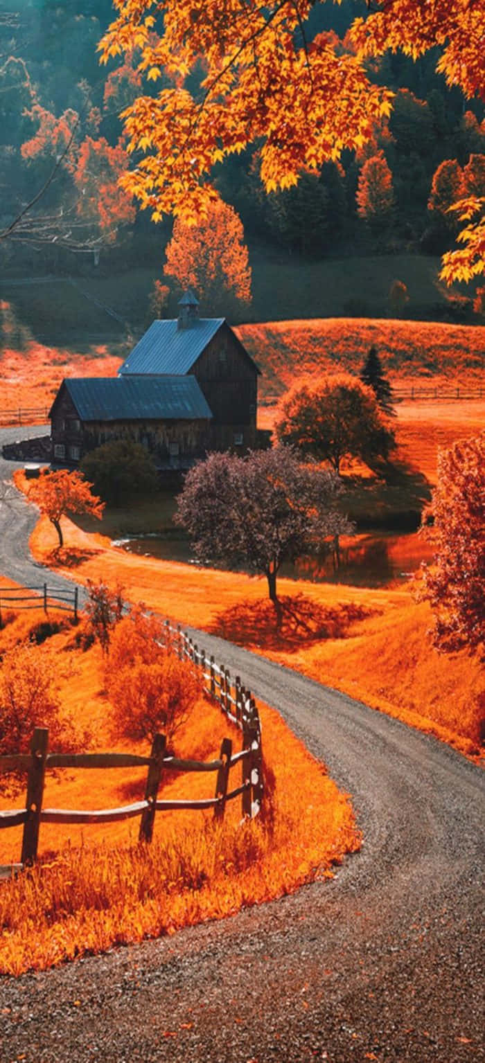 Autumn In The Countryside With A Farm And A Fence Background