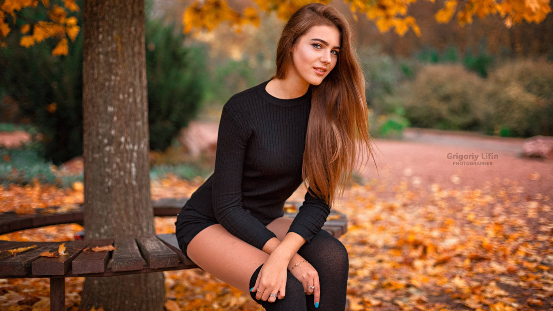 Autumn Leaves And Macbook On A Wooden Table Background