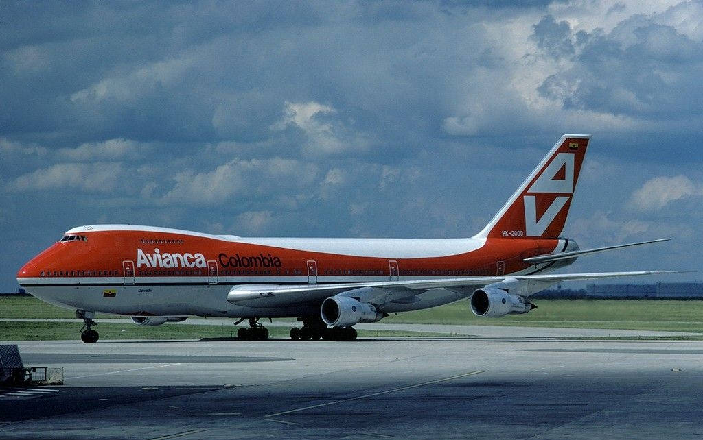 Avianca Airline Boeing 747-200 Beneath Cloudy Sky Background