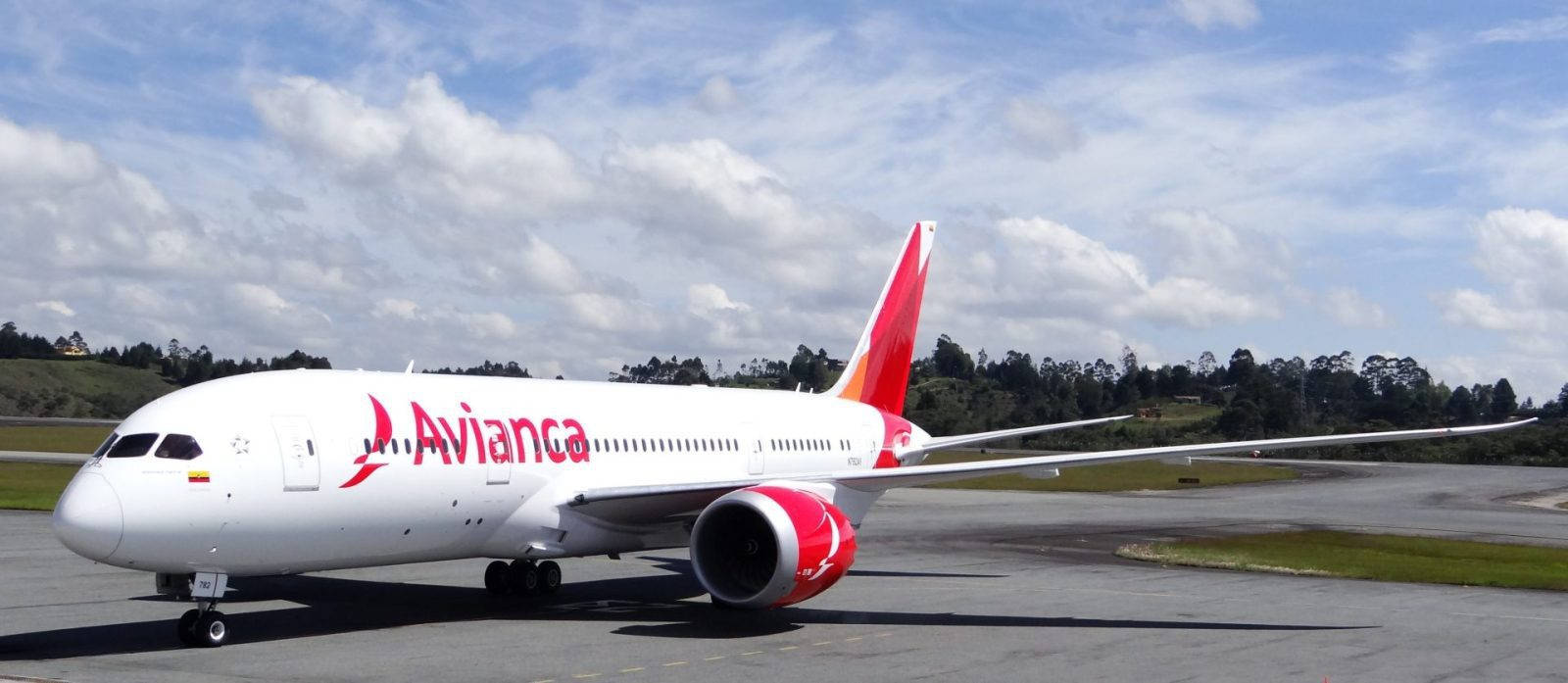 Avianca Airline Boeing B787-8 Dreamliner Beneath Cloudy Sky Background