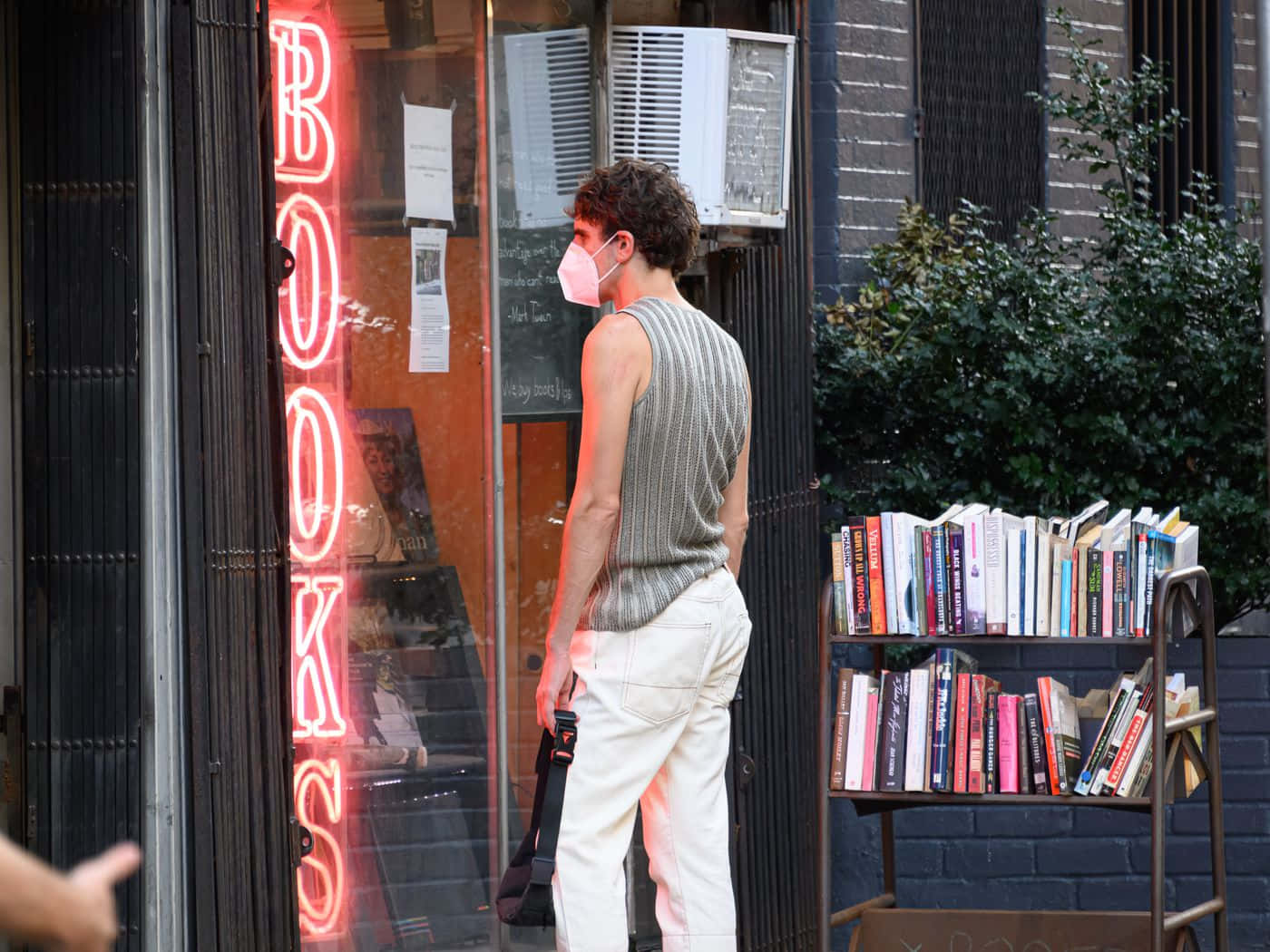 Avid Reader Exploring A Local Book Store Background