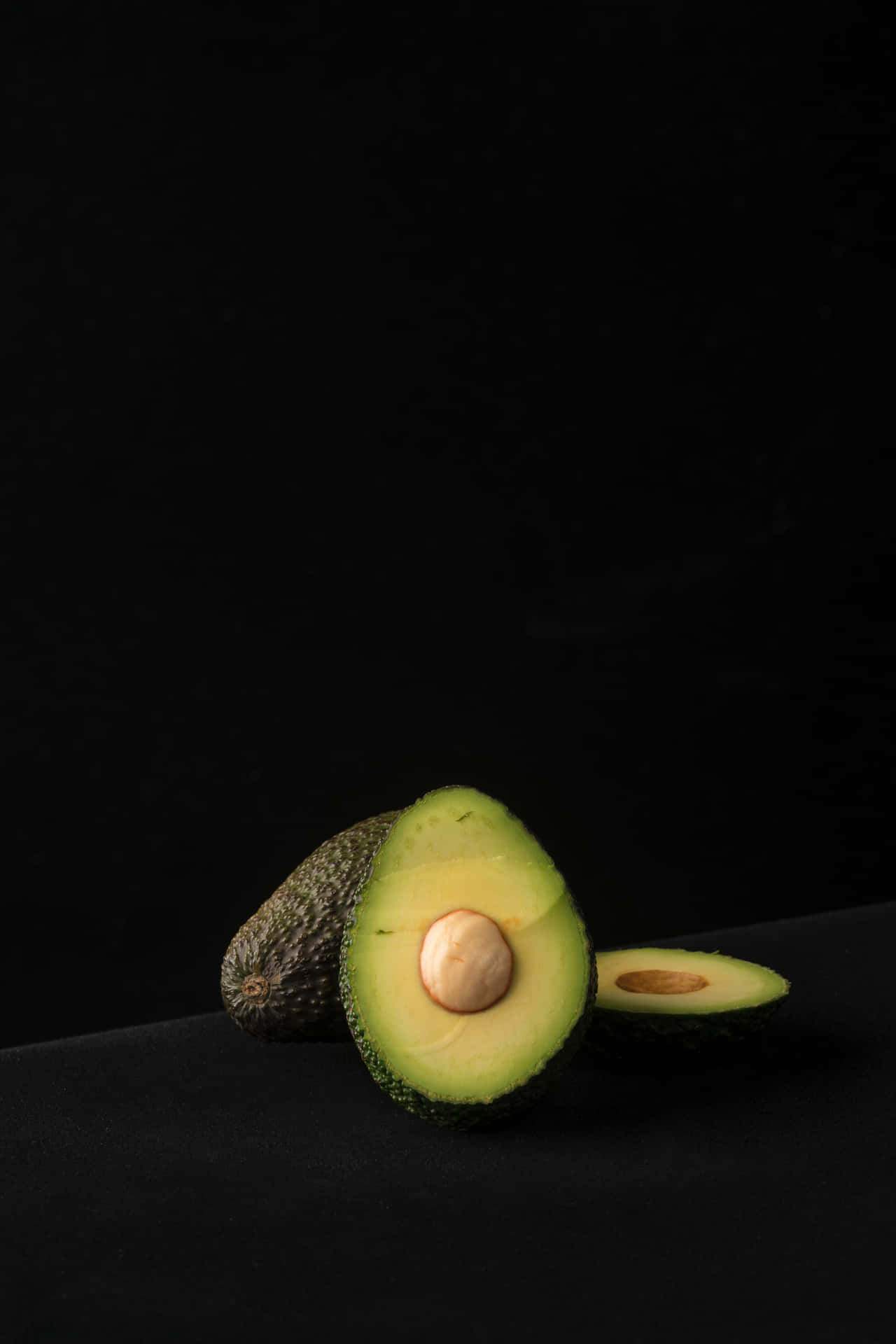 Avocado Iphone In A Dark Room Background