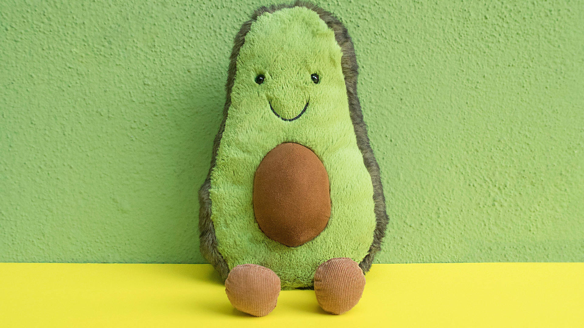 Avocado Stuffed Toy On Pastel Green Background