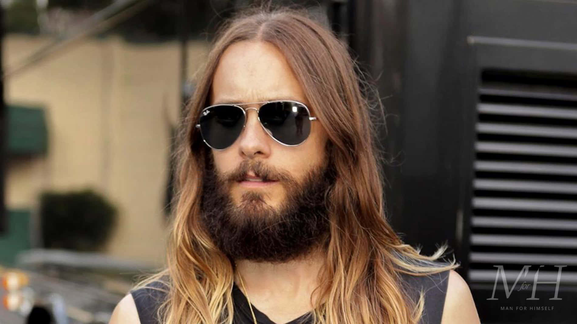 Award-winning Actor Jared Leto Captured In A Moment Of Contemplation. Background