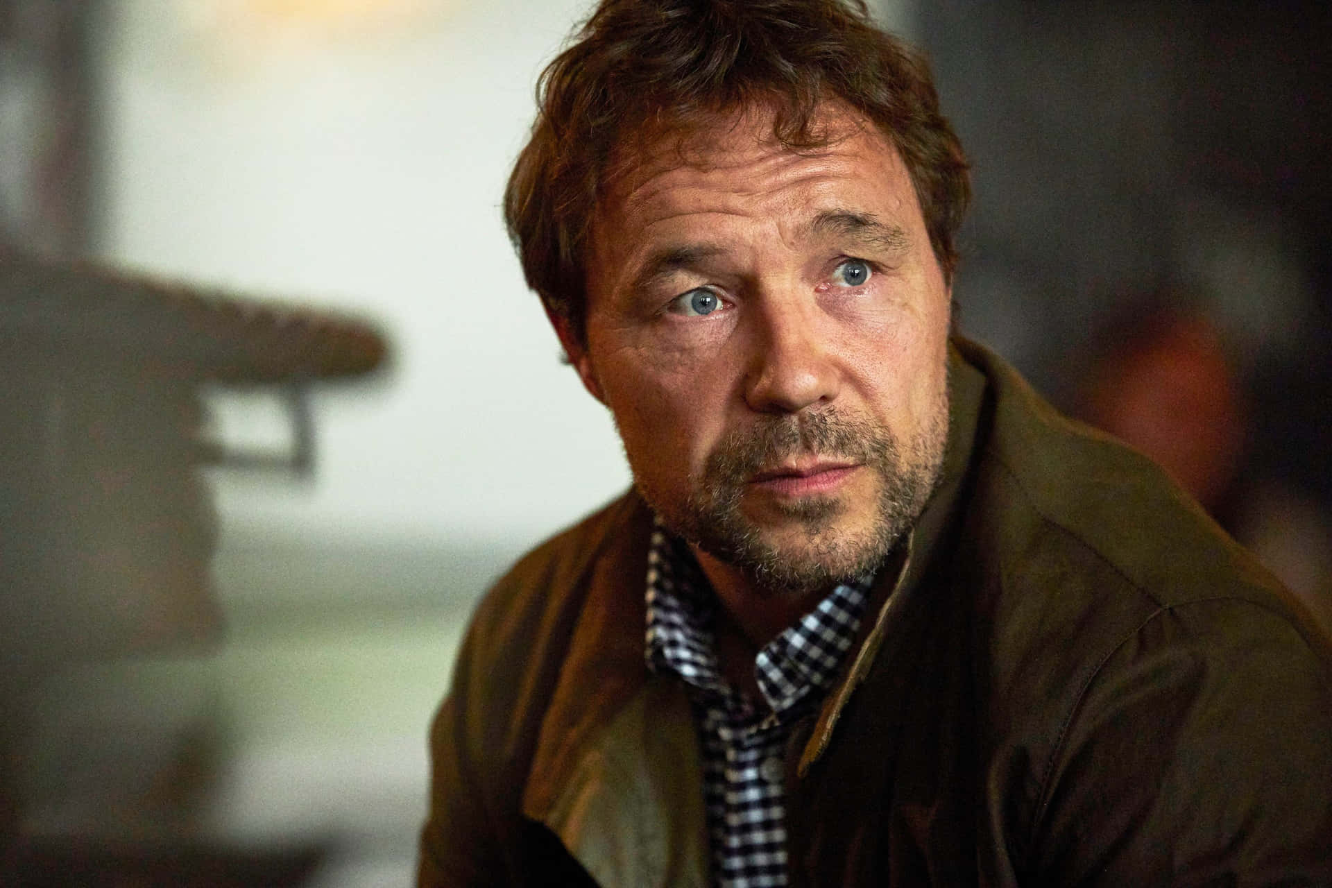 Award-winning Actor Stephen Graham In A Thoughtful Pose Background