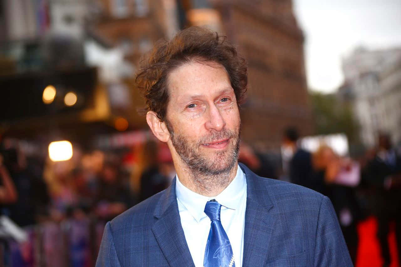 Award-winning Actor Tim Blake Nelson Smiling In A Studio Photoshoot