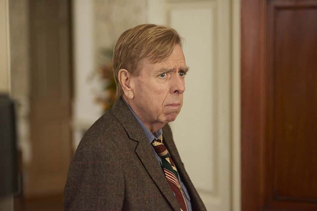 Award-winning Actor Timothy Spall In A Contemplative Pose Background