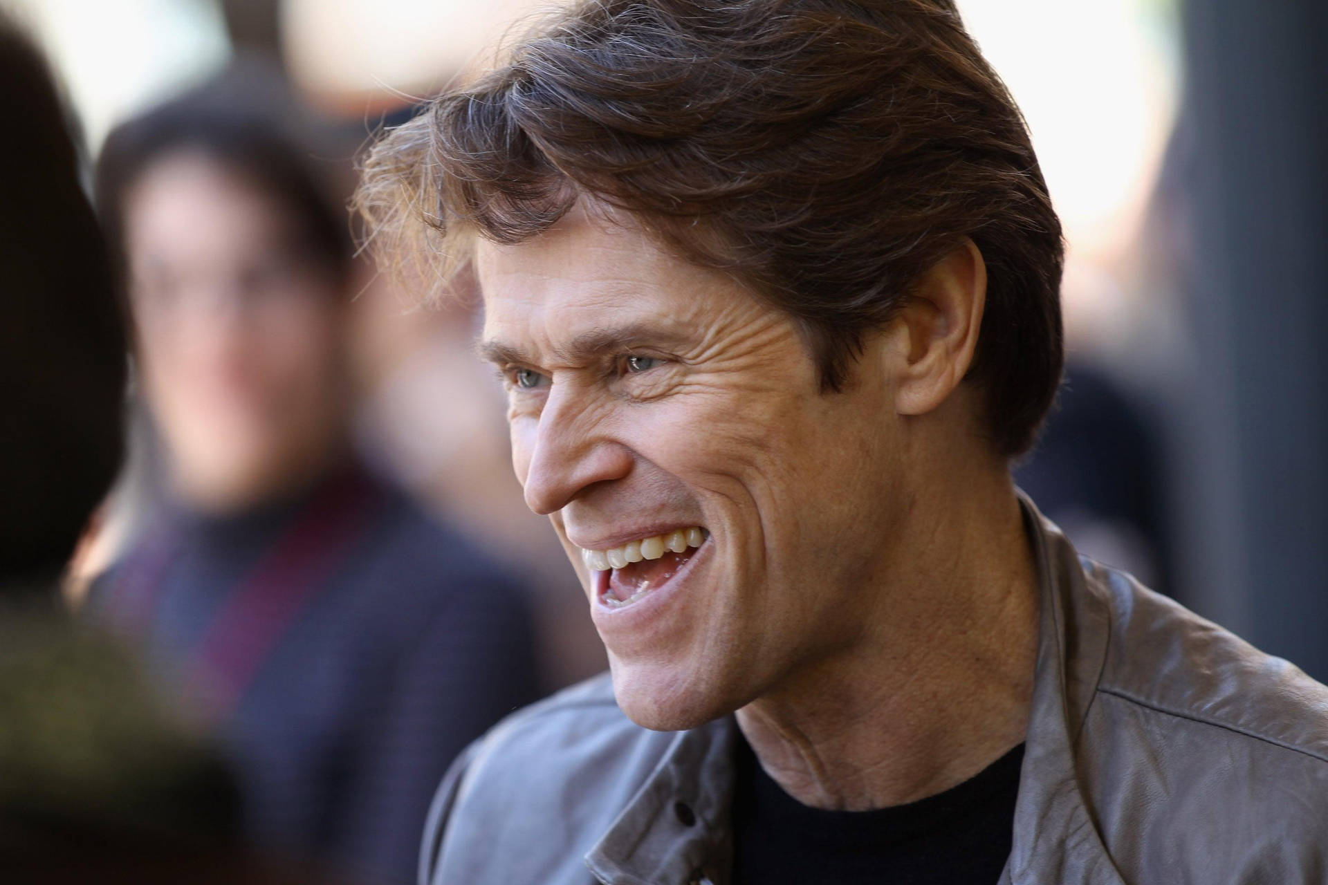 Award-winning Actor Willem Dafoe In A Captivating Side Profile View.
