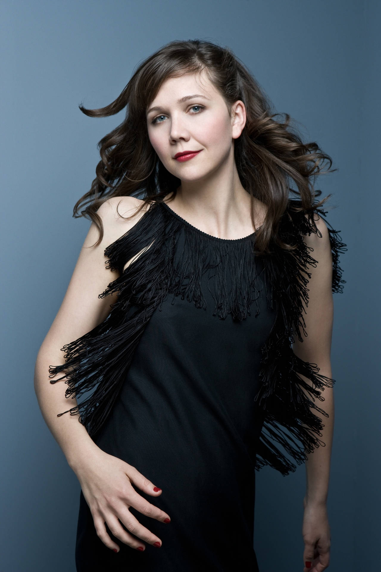 Award-winning Actress, Maggie Gyllenhaal In A Striking Pose Background