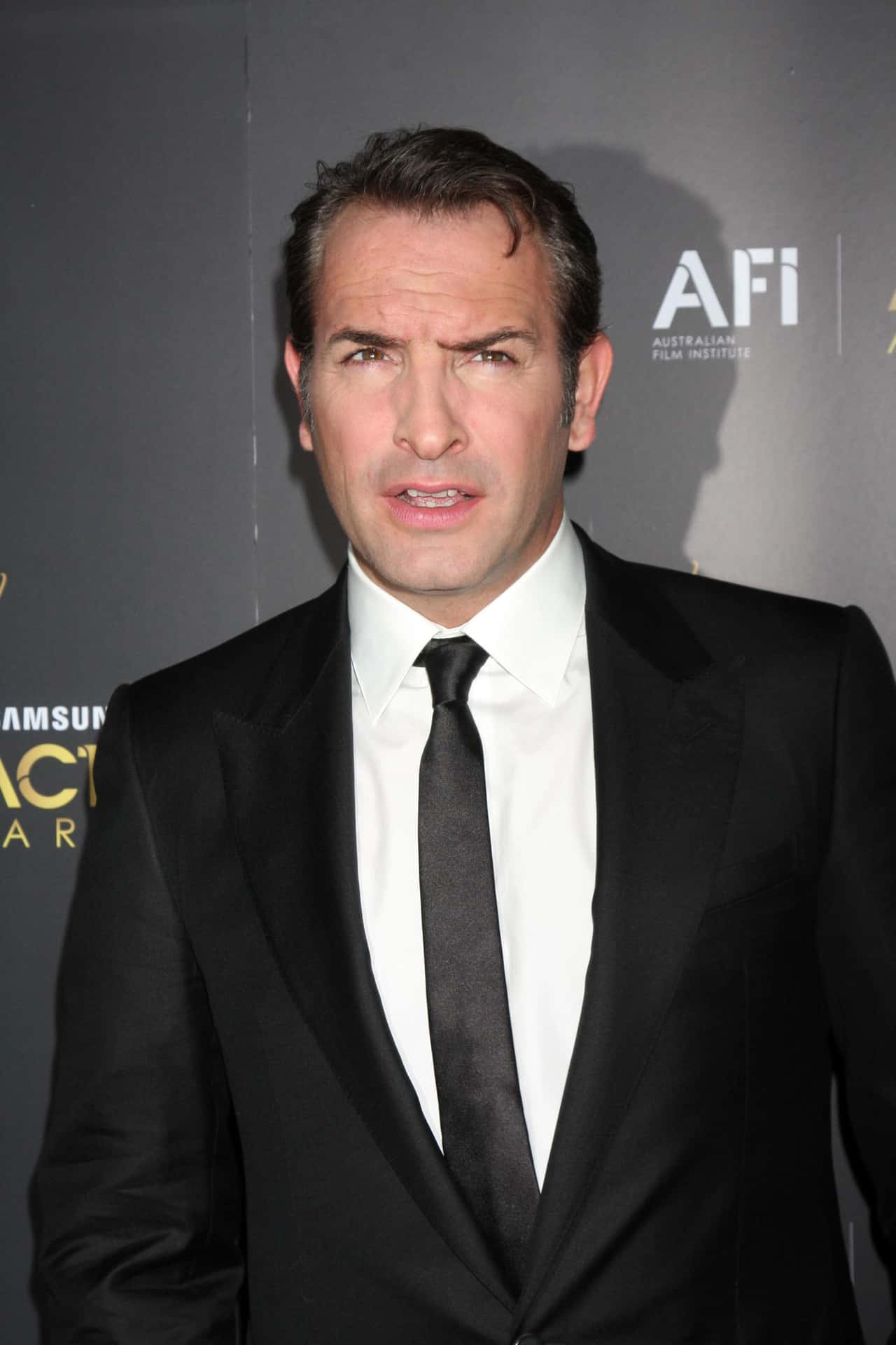 Award Winning French Actor Jean Dujardin Background