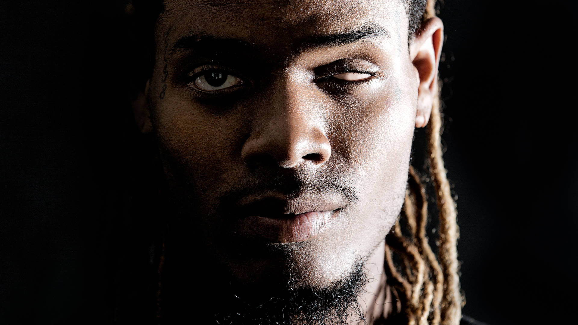 Award-winning Musician Fetty Wap Posing With Gold Chains Background