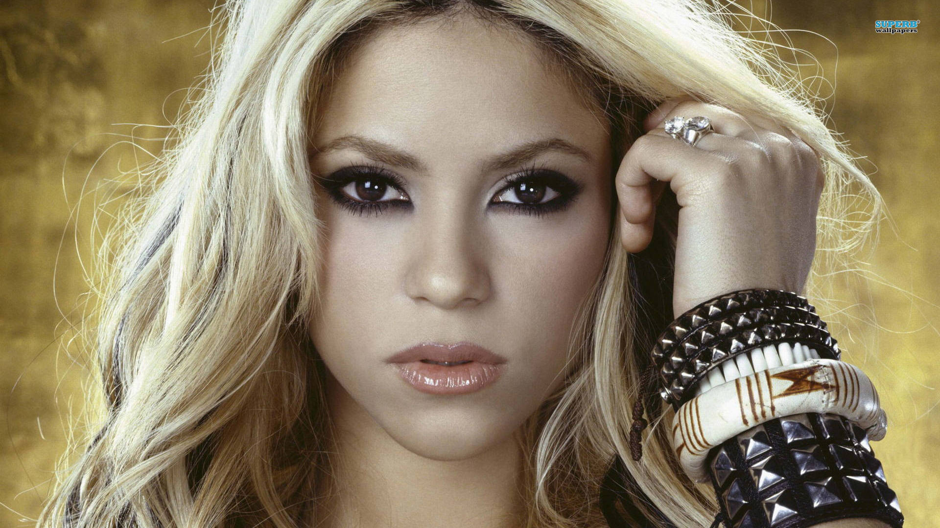 Award-winning Pop Artist, Shakira, Donning A Stylish Black Bracelet Background