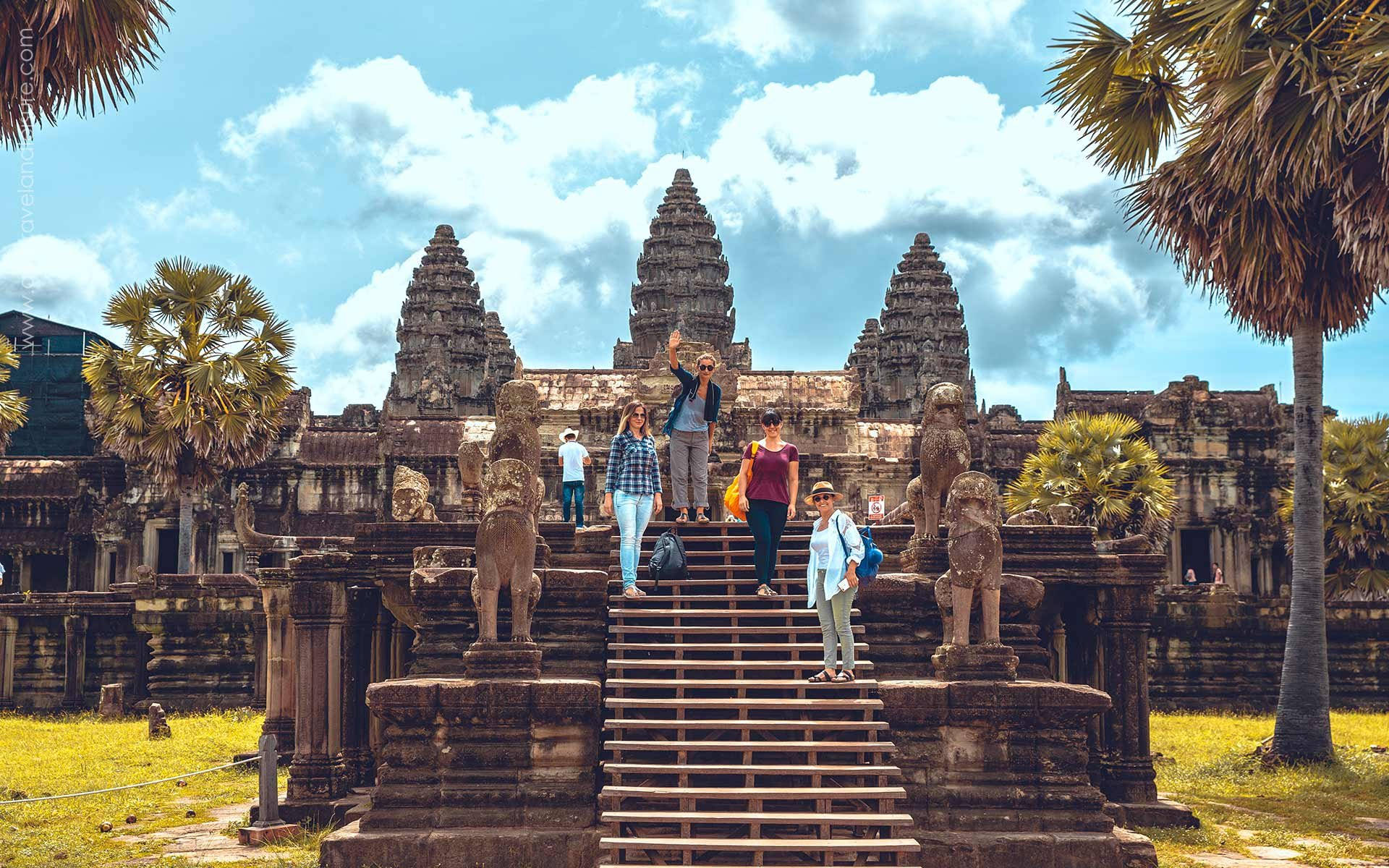 Awe-inspiring Angkor Wat: Tourists Among Ancient Ruins. Background