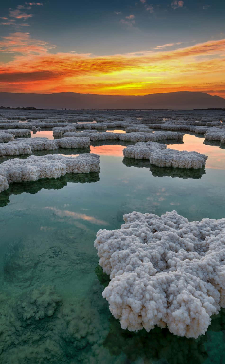 Awe-inspiring View Of Rocky Salt Formations At The Dead Sea Background