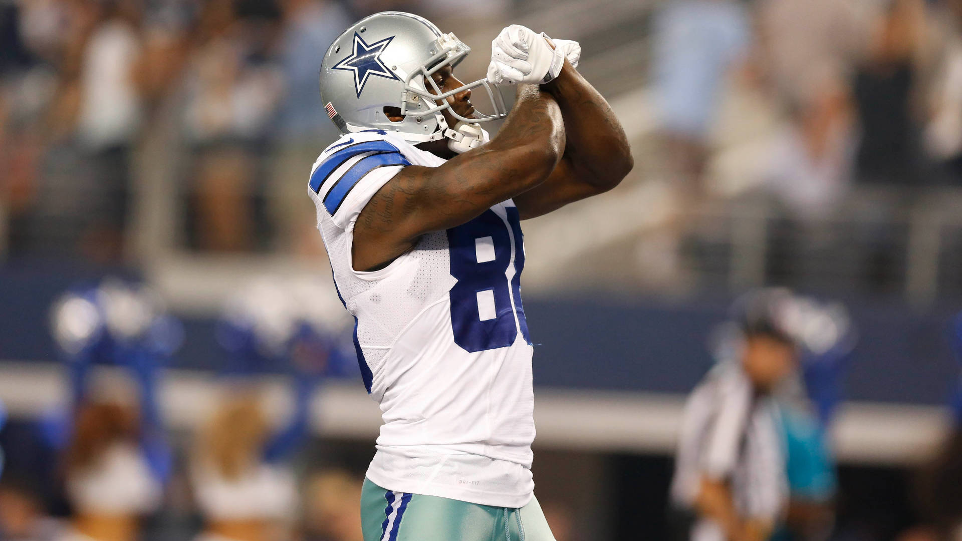 Awesome Dallas Cowboys Player With Arms Crossed Background