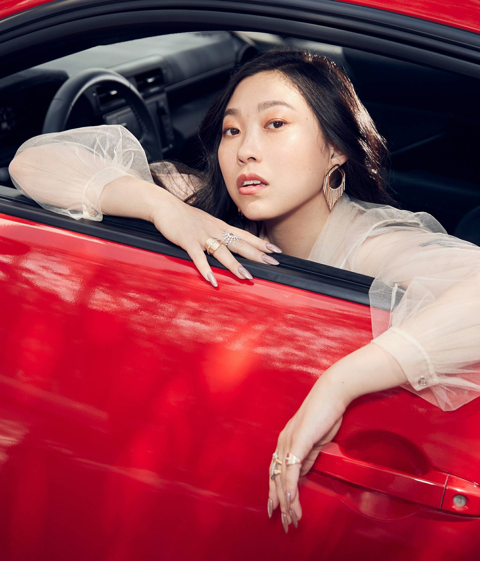 Awkwafina In Red Painted Car Background