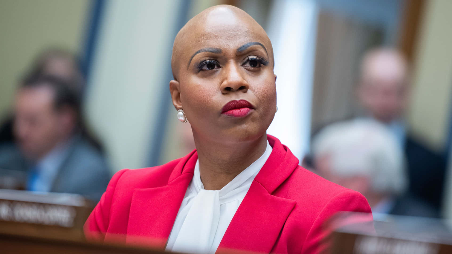 Ayanna Pressley - Empowered And Eloquent In Red Background