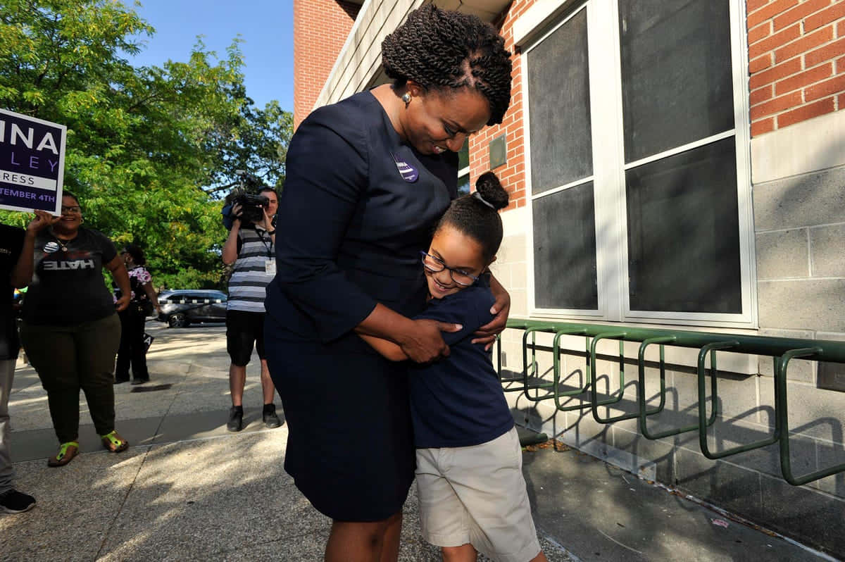 Ayanna Pressley Hugging Kid