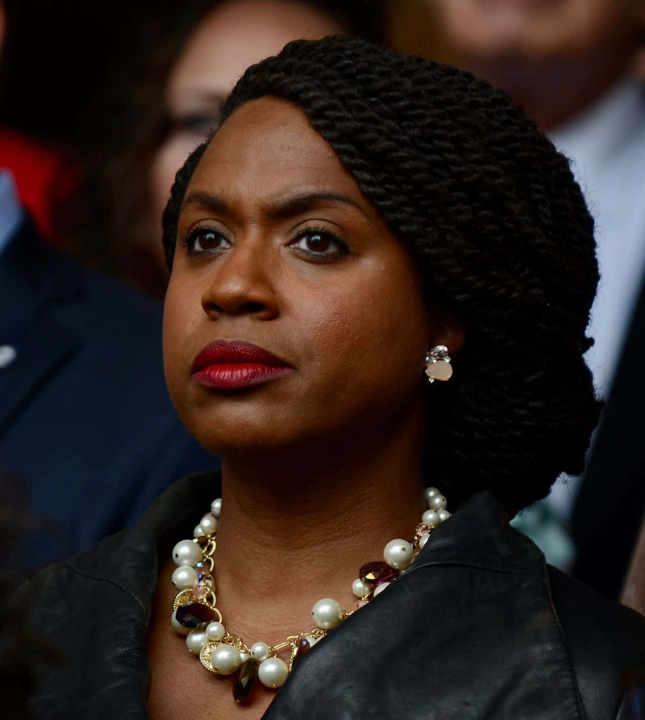 Ayanna Pressley In A Serious Pose Dressed In Black.