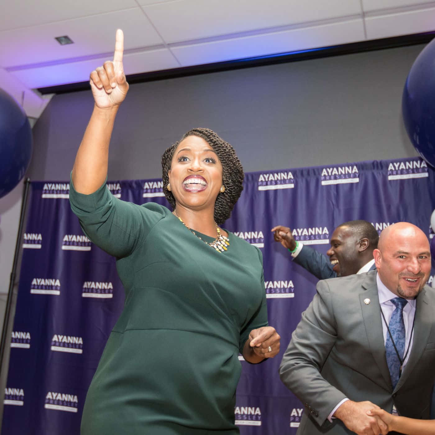 Ayanna Pressley Pointing Upwards Background