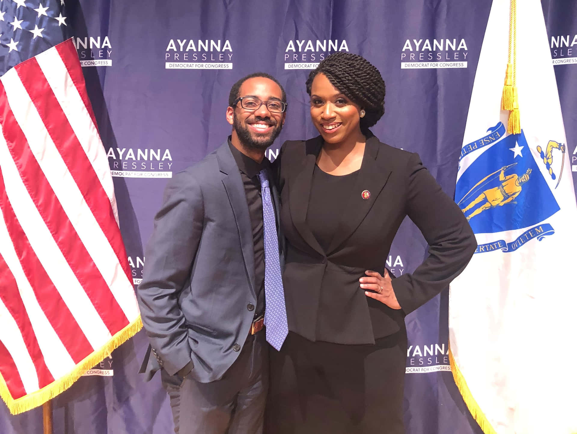 Ayanna Pressley Smiling With Smiling Man Background