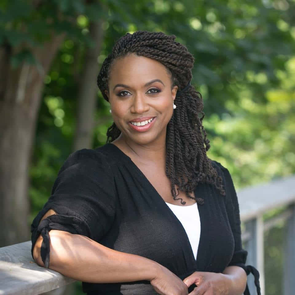 Ayanna Pressley Striking A Pose Outdoors. Background