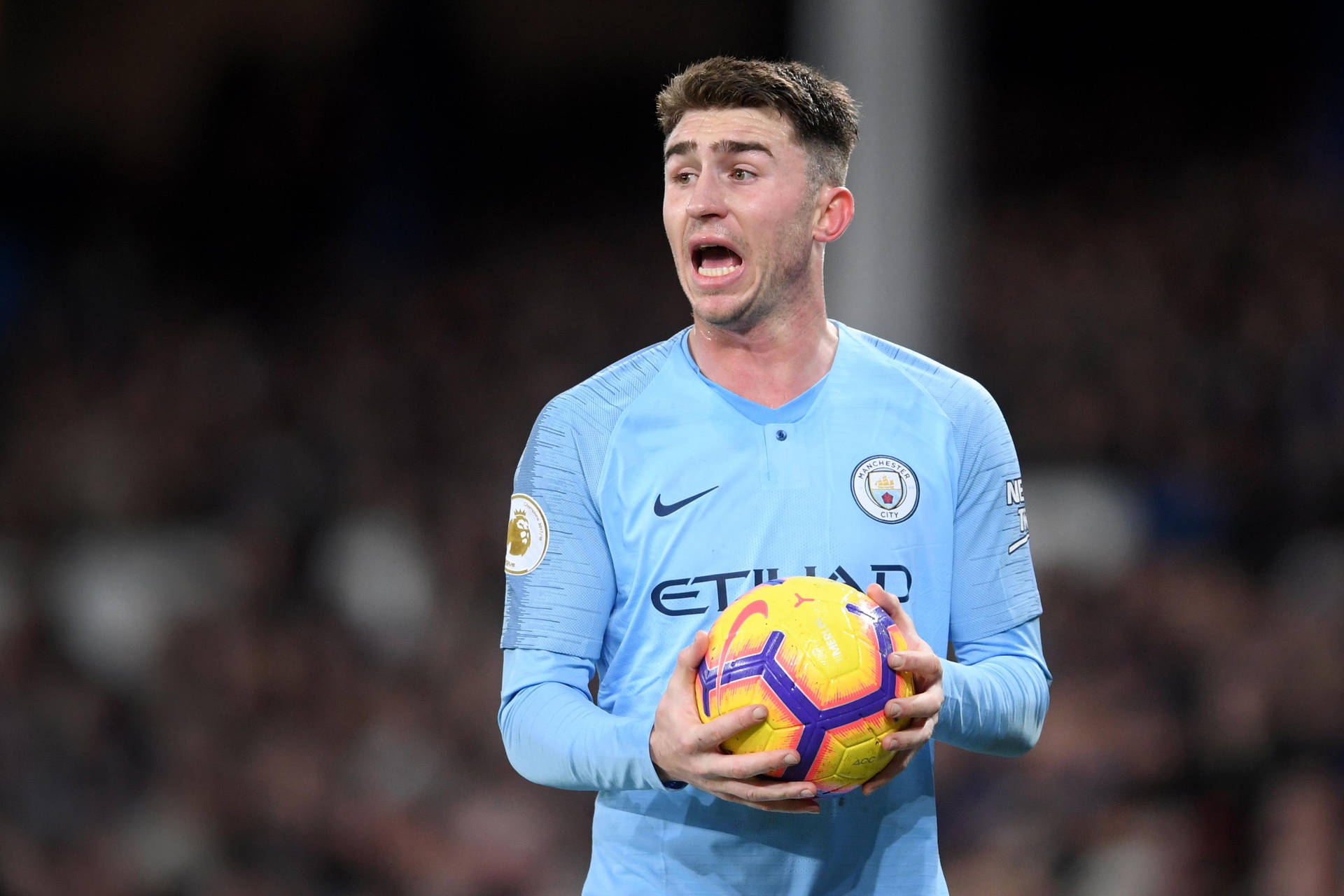 Aymeric Laporte Holding Football Background