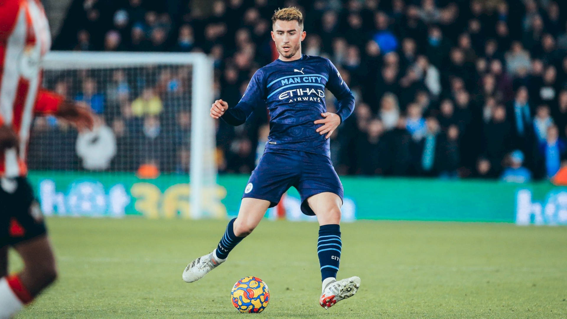 Aymeric Laporte Kicking Colorful Football Background