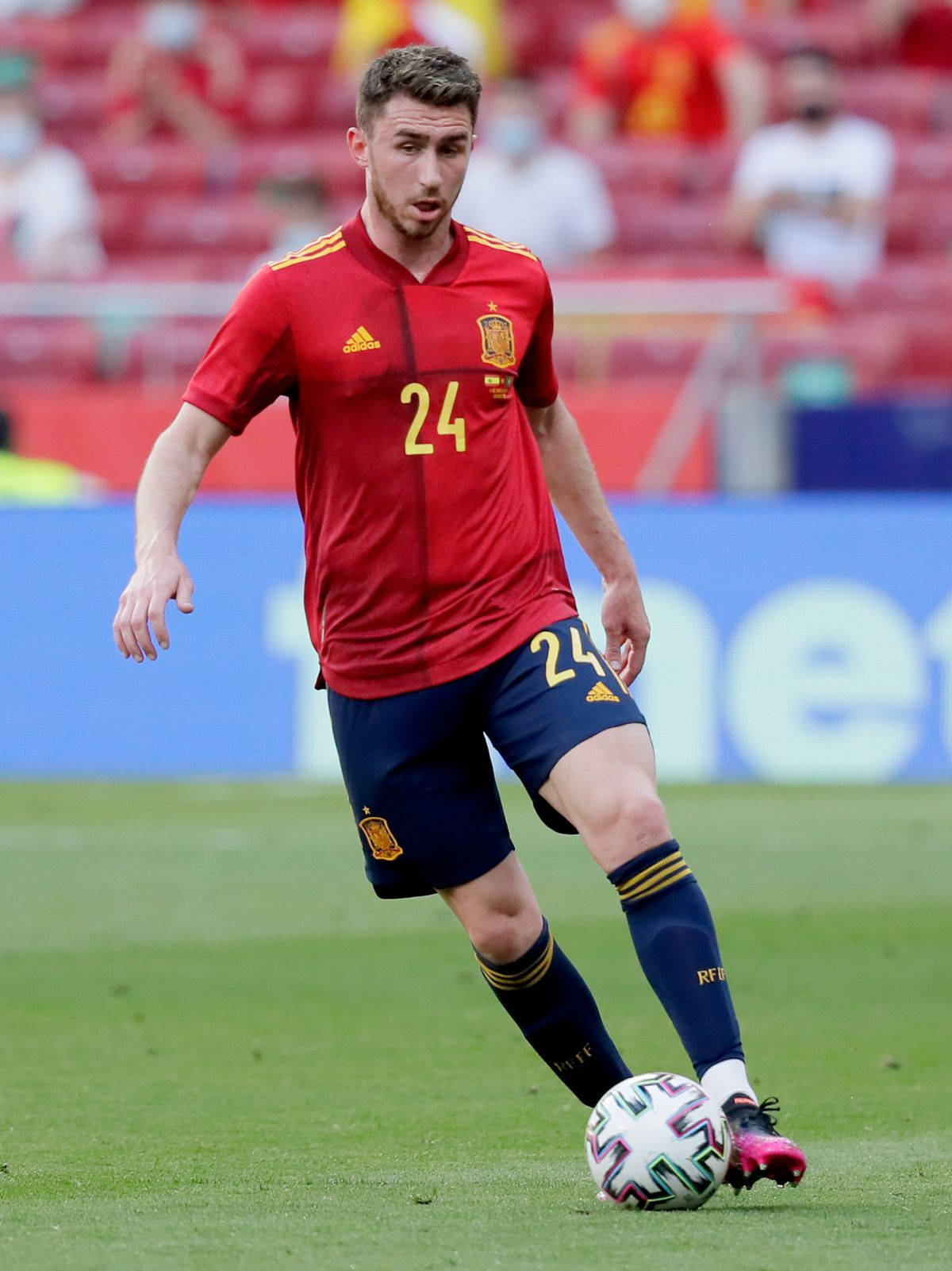 Aymeric Laporte Running In Red Jersey Background